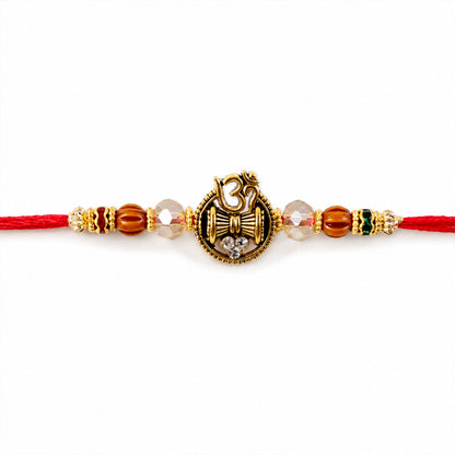 Om Damru Trishul Devotional Rakhi with Sparkling Stones and Brown Beads