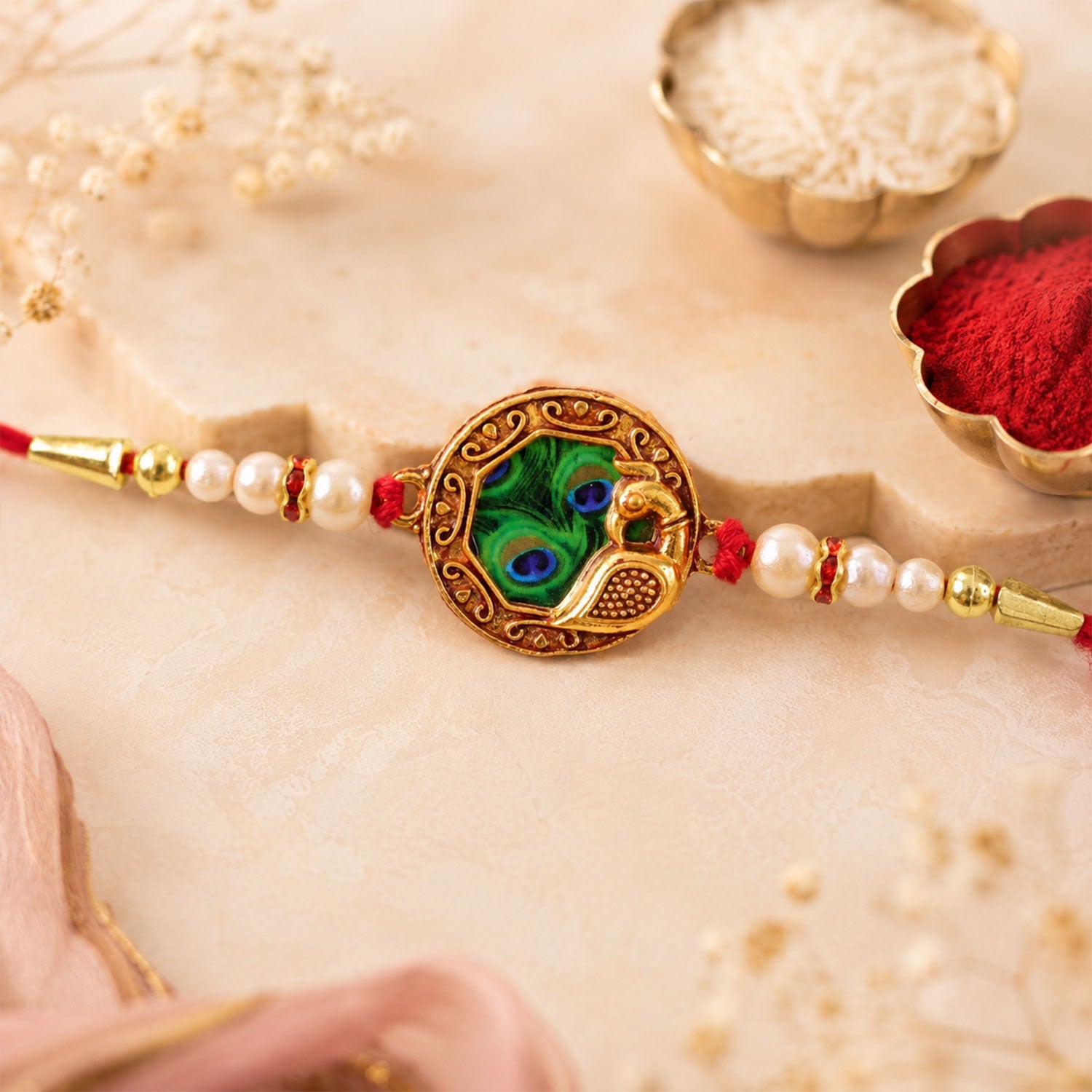 Shop Peacock Feather Rakhi with Pearl Bead Accents Red Thread (5pcs)