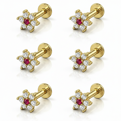 Close view of gold plated ruby and cubic zirconia flower nosepin stud
