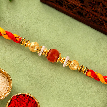 Beautiful Pearl Bead Rakhi with Soft Festive Shades and Elegant Designer Look