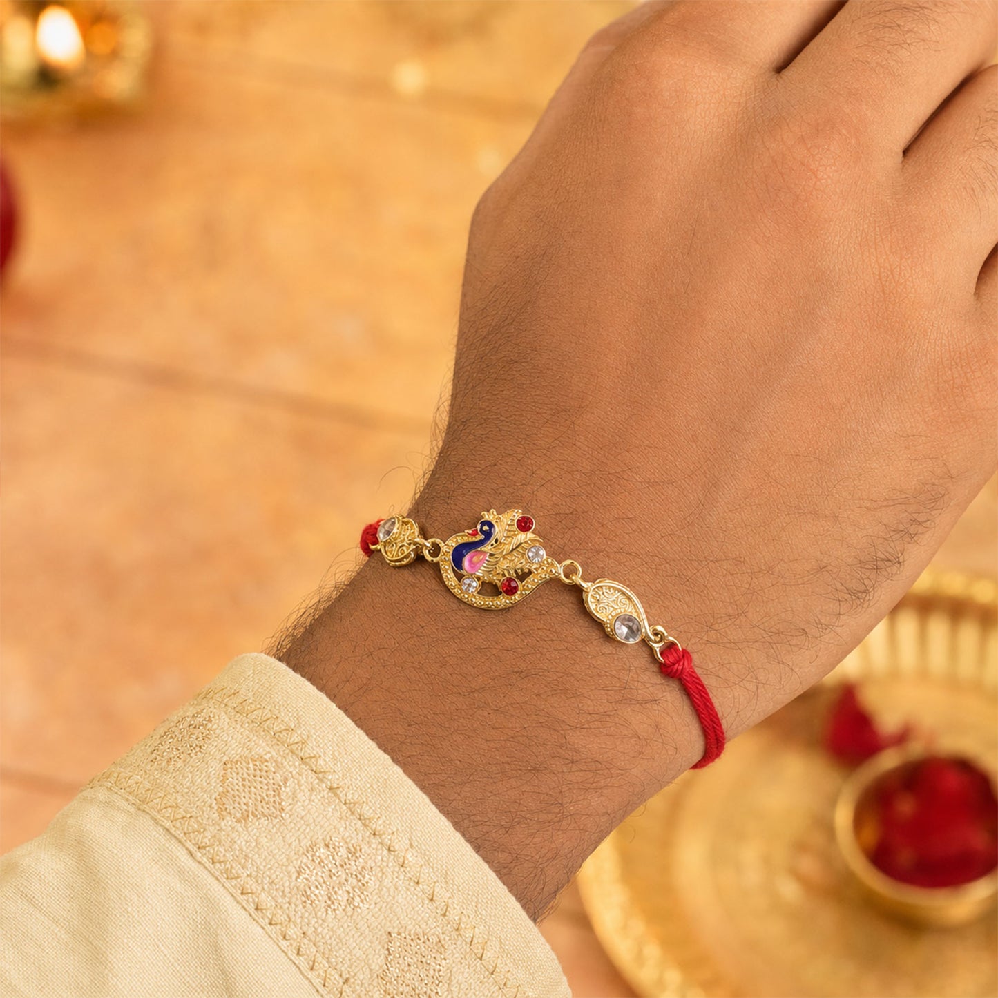 Elegant Rakhi showcasing Peacock Charm, color stones and gift style for Gift Styling