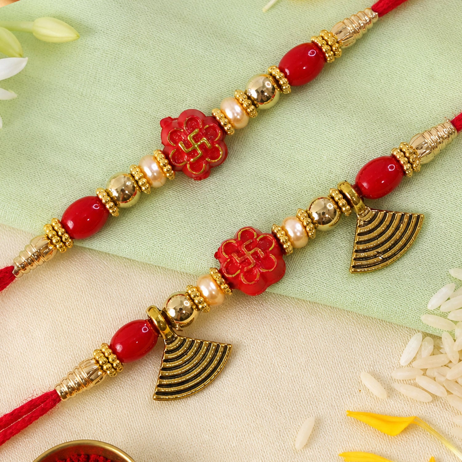 Bhai Bhabhi Floral Charm Rakhi Set with Red Thread, Gold Beads and Black Fan Drops