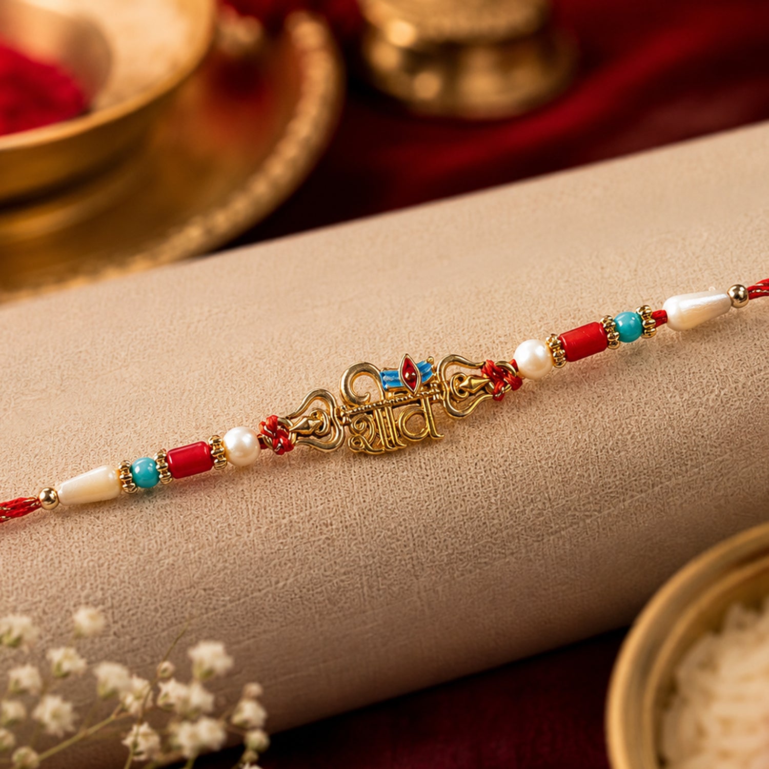 Shiv Script Pendant Rakhi with Blue Trishul Accent and Pearl Beads