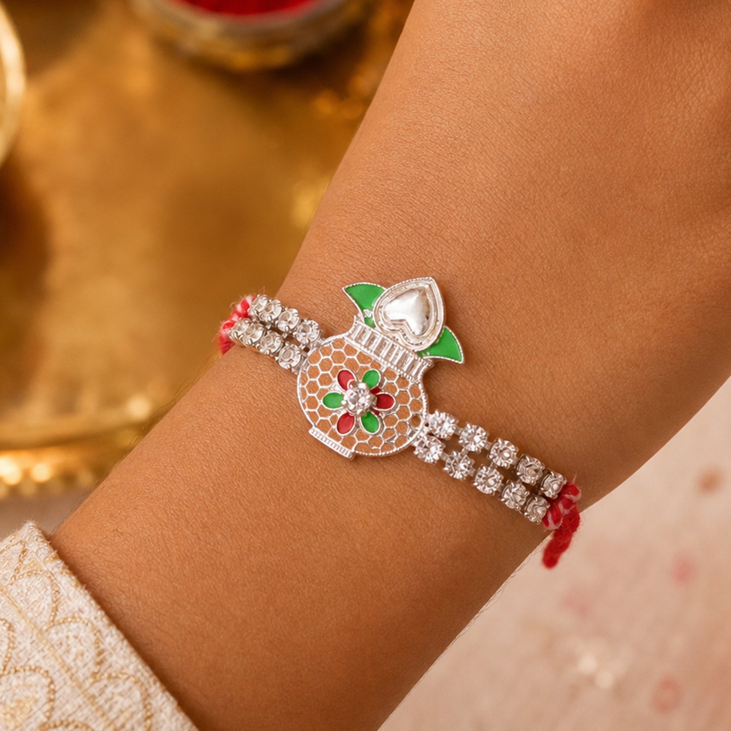 Premium Rakhi showcasing Kalash Charm, gold trims and thread style for Gift Styling