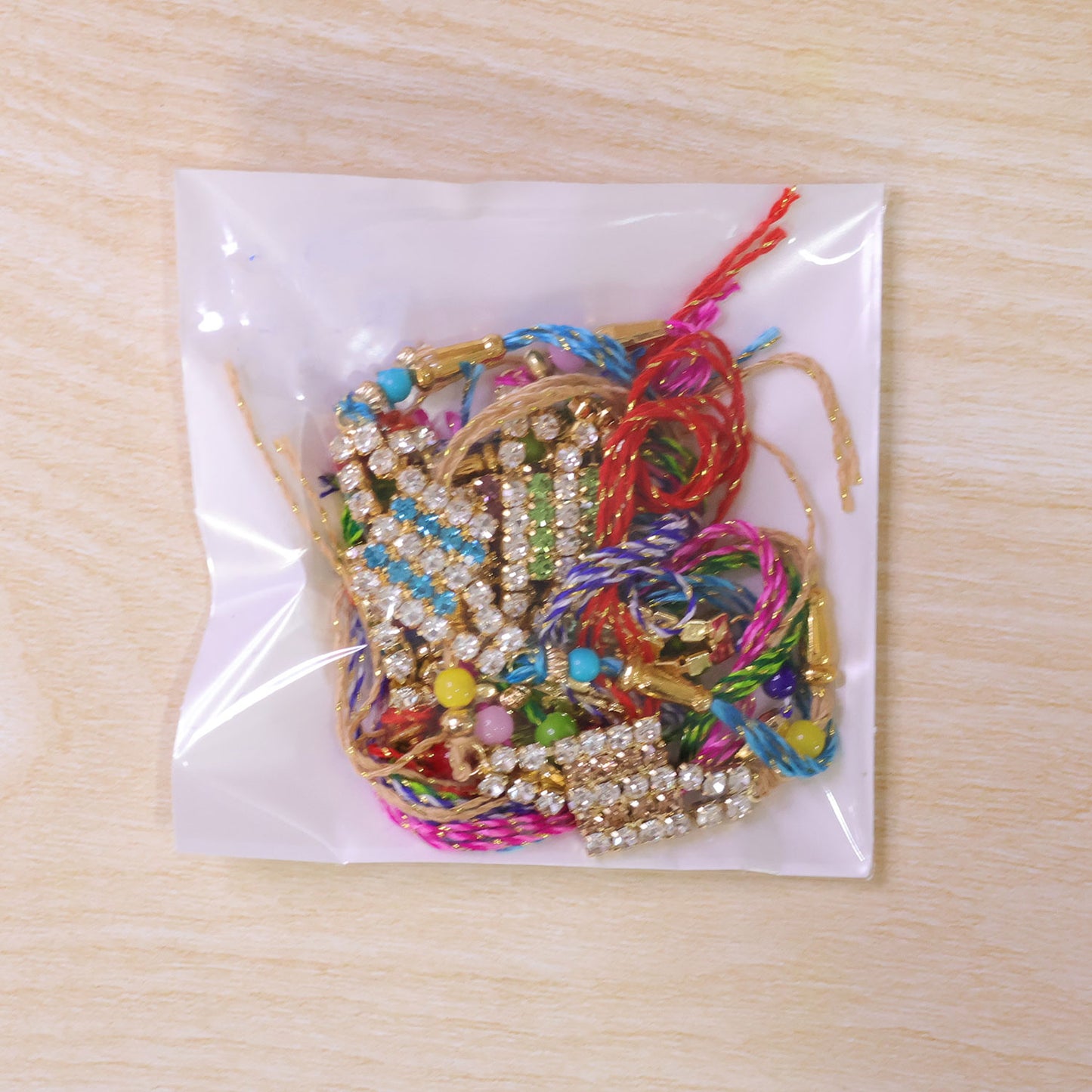 Layered Diamond Motif Rakhi in Mix Colour Threads (Pack of 6)