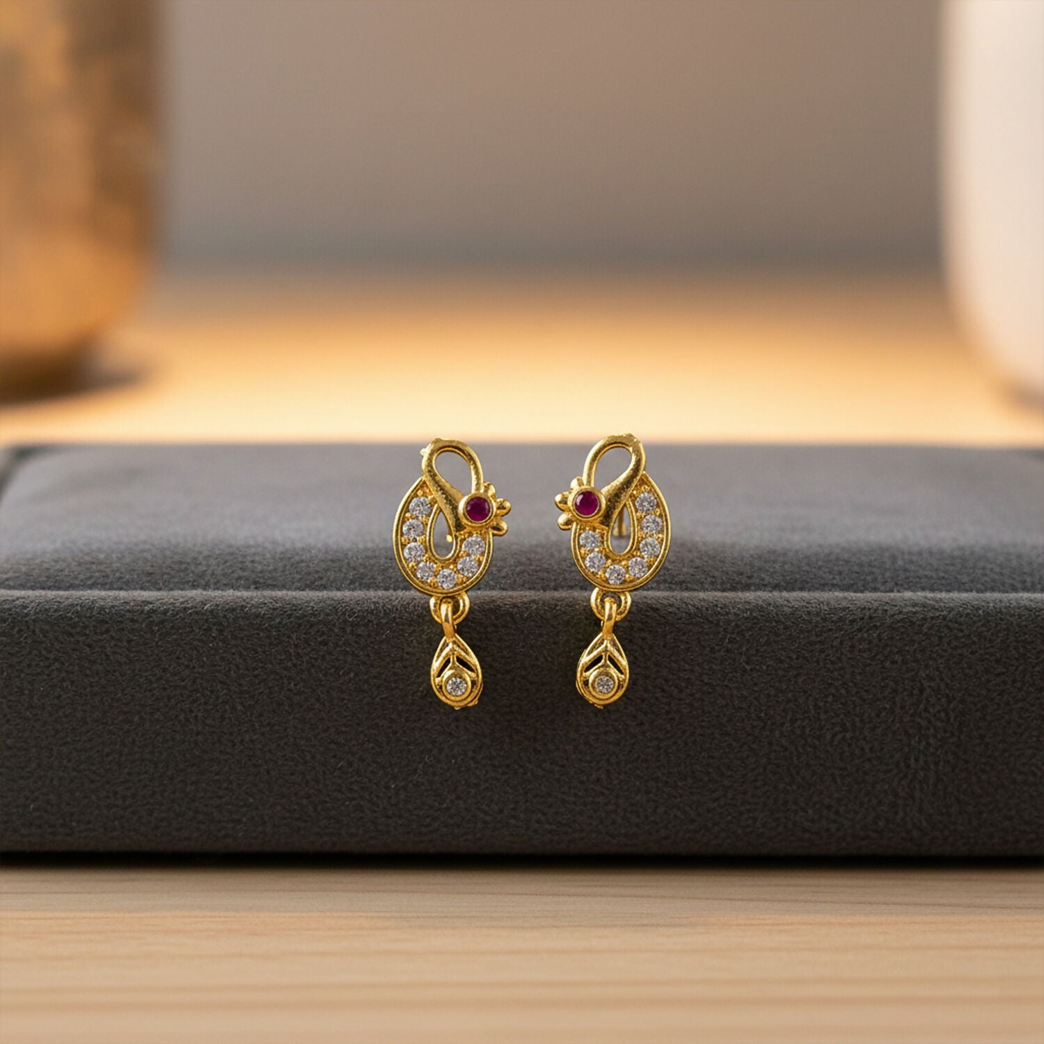 Classic Gold Finish Earrings with Crystal Detailing & Red Stone