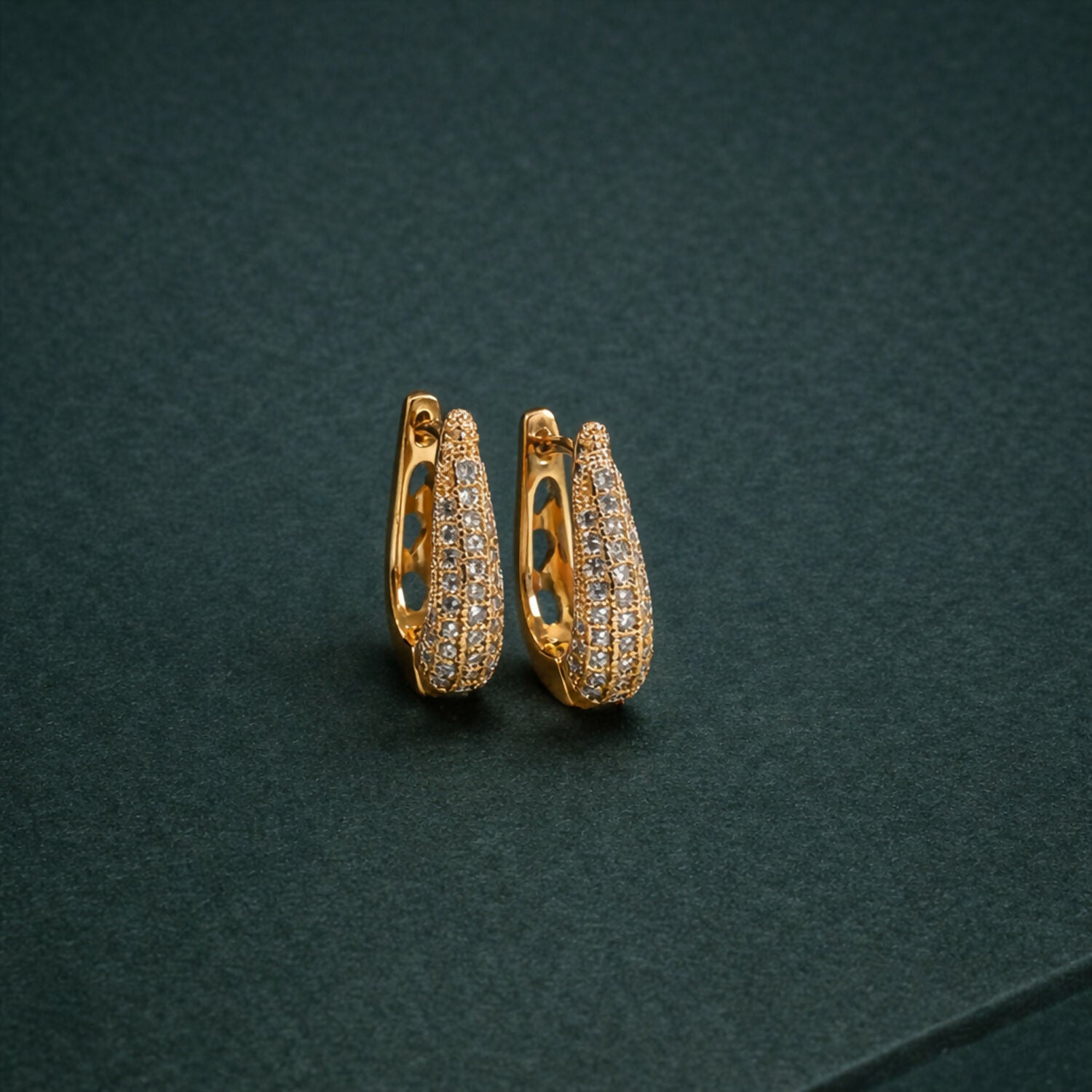Elegant Curved Pavé Crystal Huggie Earrings in Gold Finish