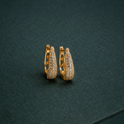 Elegant Curved Pavé Crystal Huggie Earrings in Gold Finish