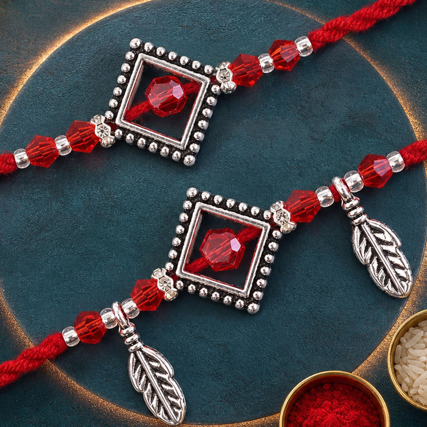 Red Gem Square Rakhi Set with Silver Bead Border and Leaf Charms for Couple Gift