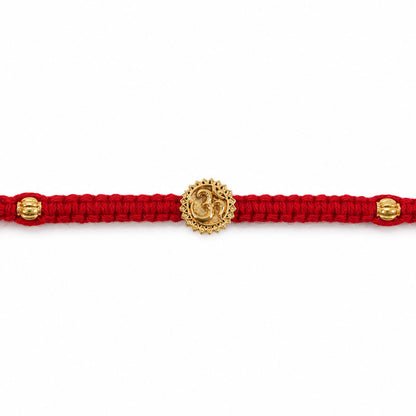 Red Thread Rakhi with an Antique Gold Om Pendant and Beaded Accents