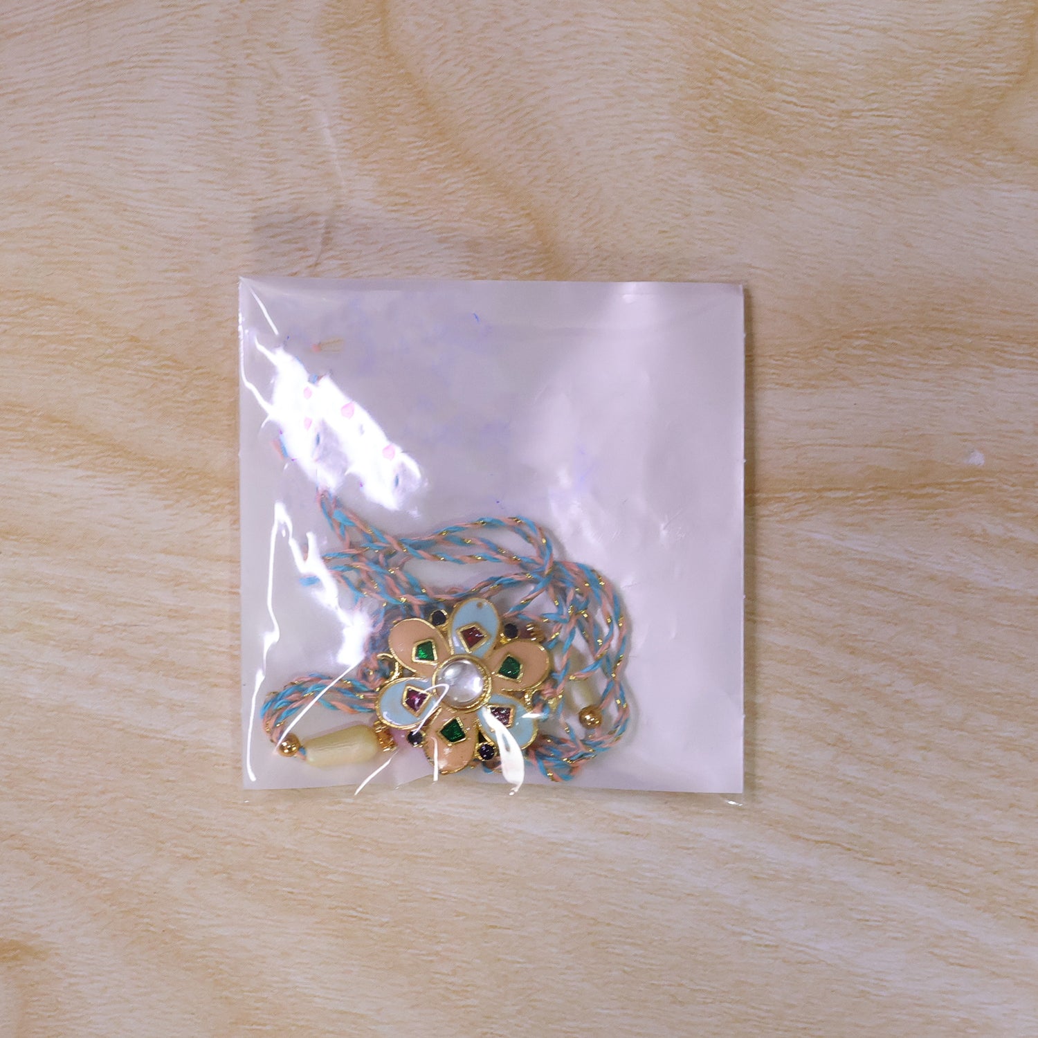 Eight Petal Floral Kundan Pendant Rakhi with Pastel Beads