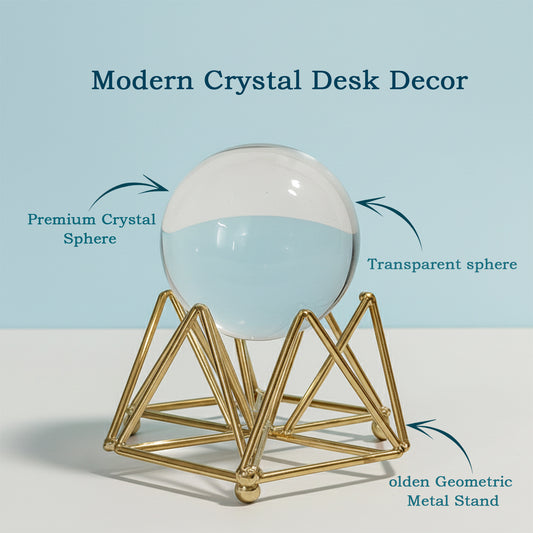 Premium Decorative Crystal Ball displayed on golden geometric stand on table