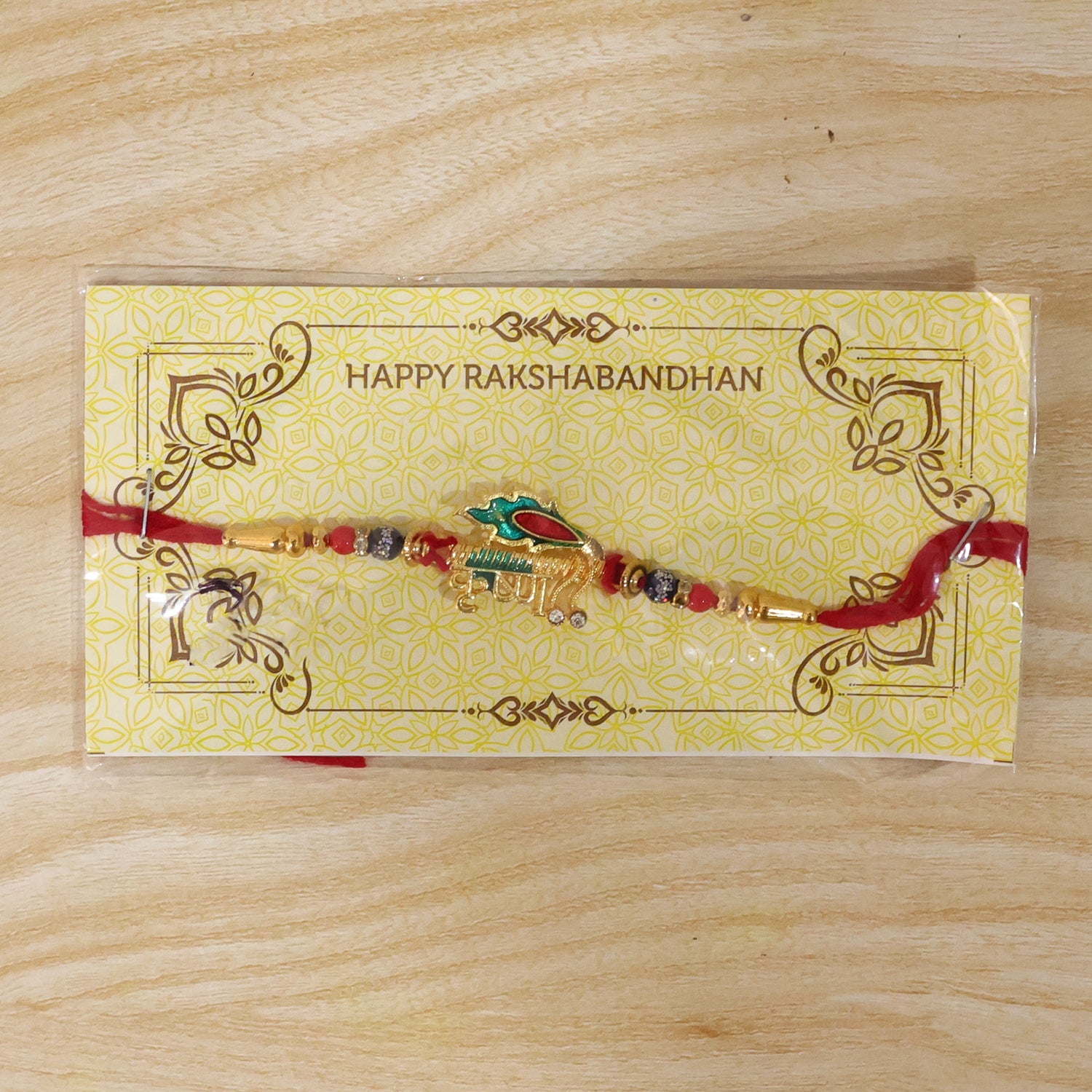 Stylish Krishna Rakhi with Red & Blue Beads for Brother