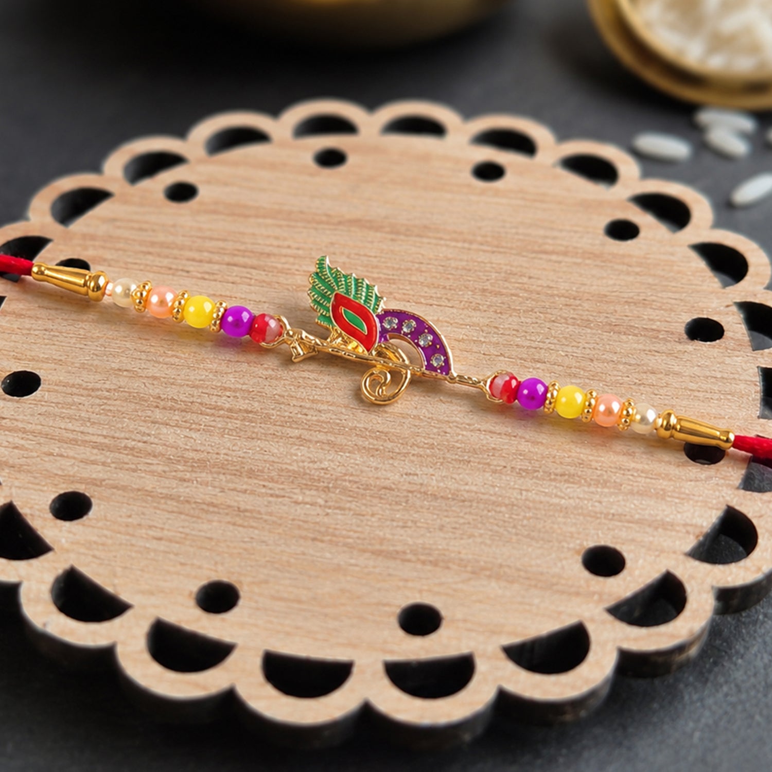 Stylish bird design traditional rakhi with colorful beads