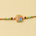 Rakhi – Colorful Peacock Design with Decorative Beads for Raksha Bandhan