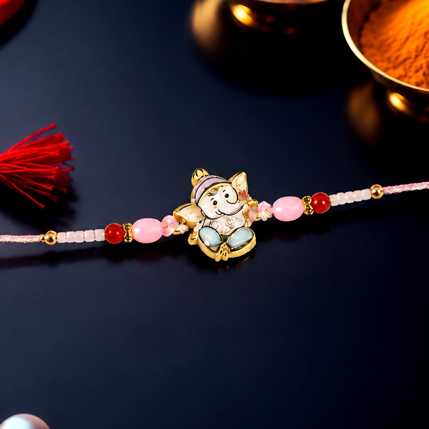 Cute Ganesha Designer Rakhi with Pink and Red Beads (1 Pc)