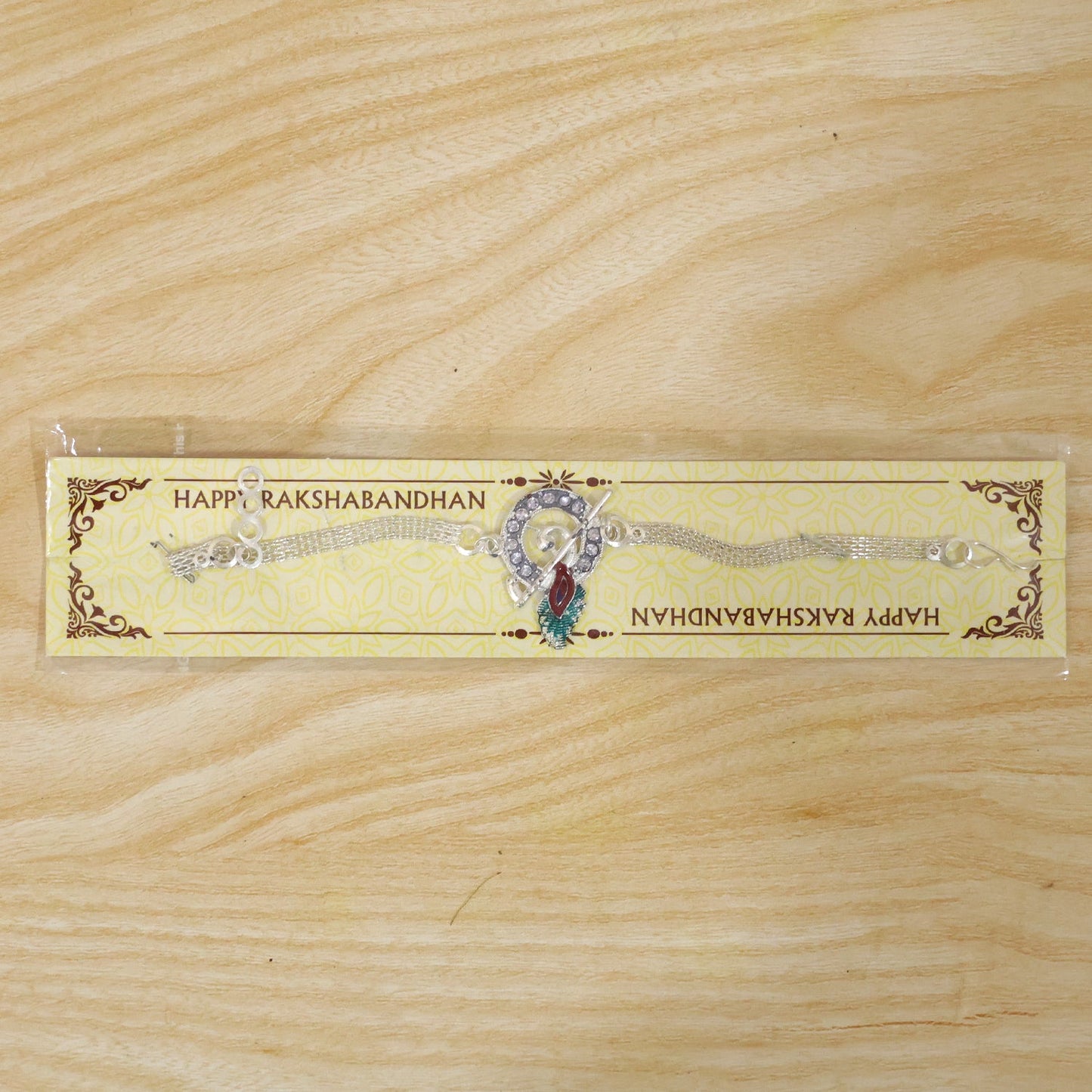 Krishna Morpankh Bansuri Stone-Studded Chain Rakhi for Brother