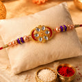 Kundan Rakhi for Brother Oval Floral Stone Studded Design