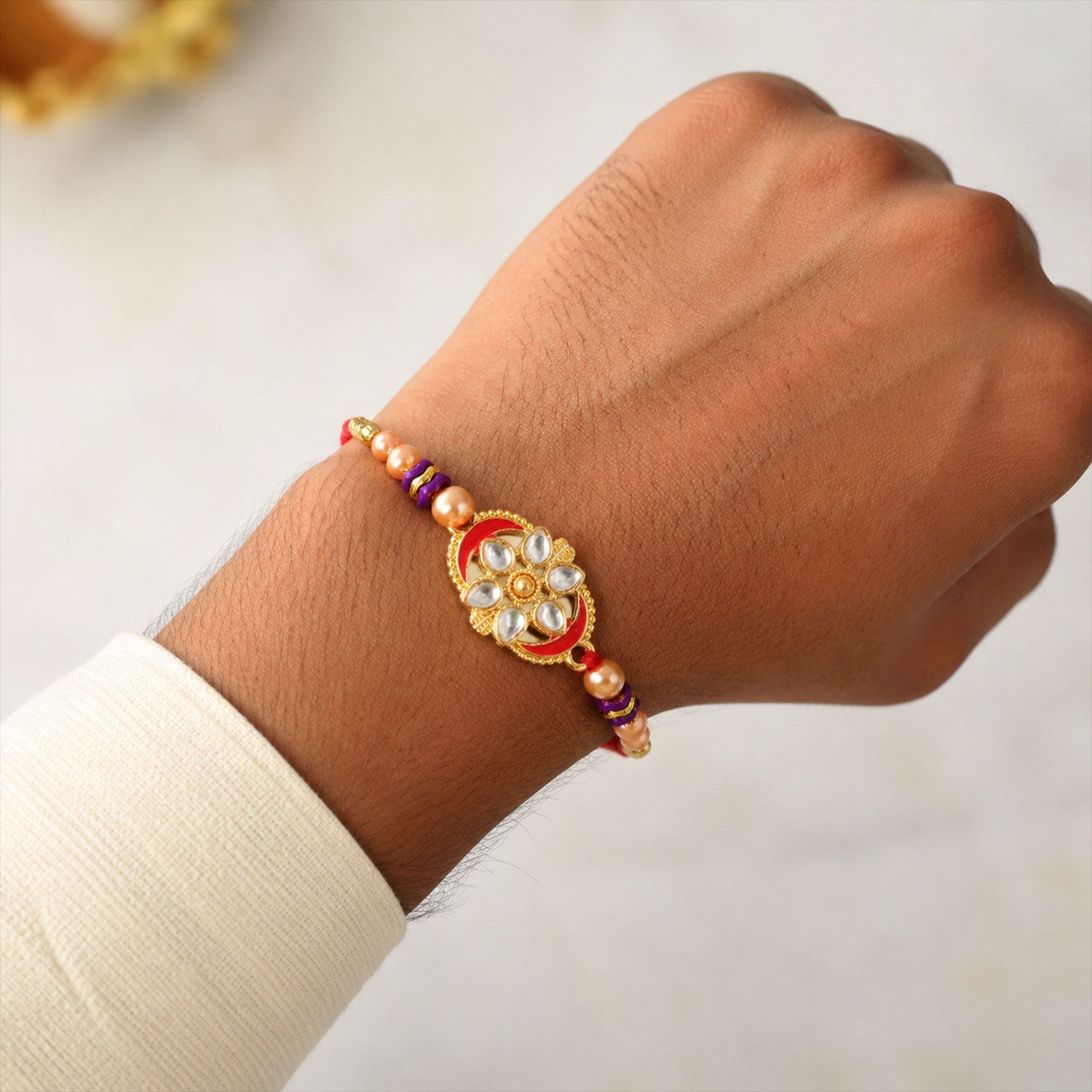Oval Kundan Floral Stone-Studded Beaded Designer Rakhi for Brother