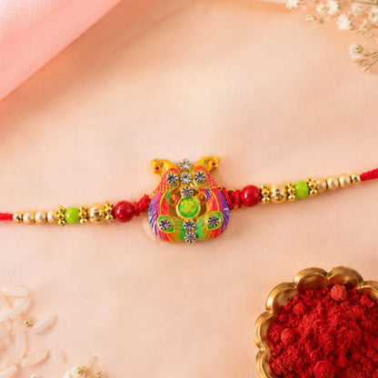 Meenakari Om Twin Peacock Stone-Studded Rakhi for Brother