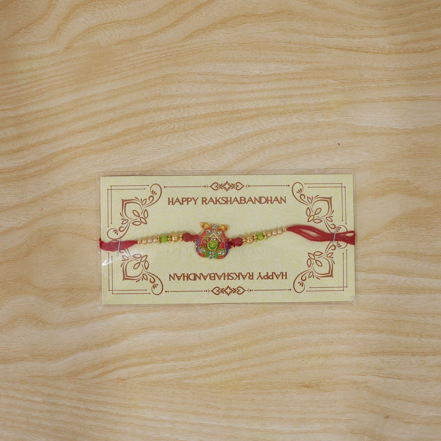 Meenakari Om Twin Peacock Stone-Studded Rakhi for Brother