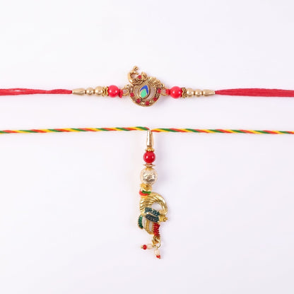 Hand holding Peacock Latkan Bhabhi Rakhi with pearl beads