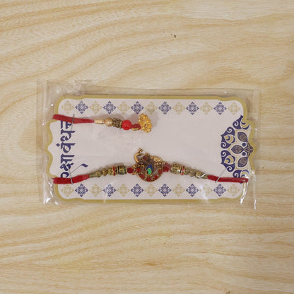 Elegant design of Kundan Peacock Bhabhi Rakhi with Pearl Latkan