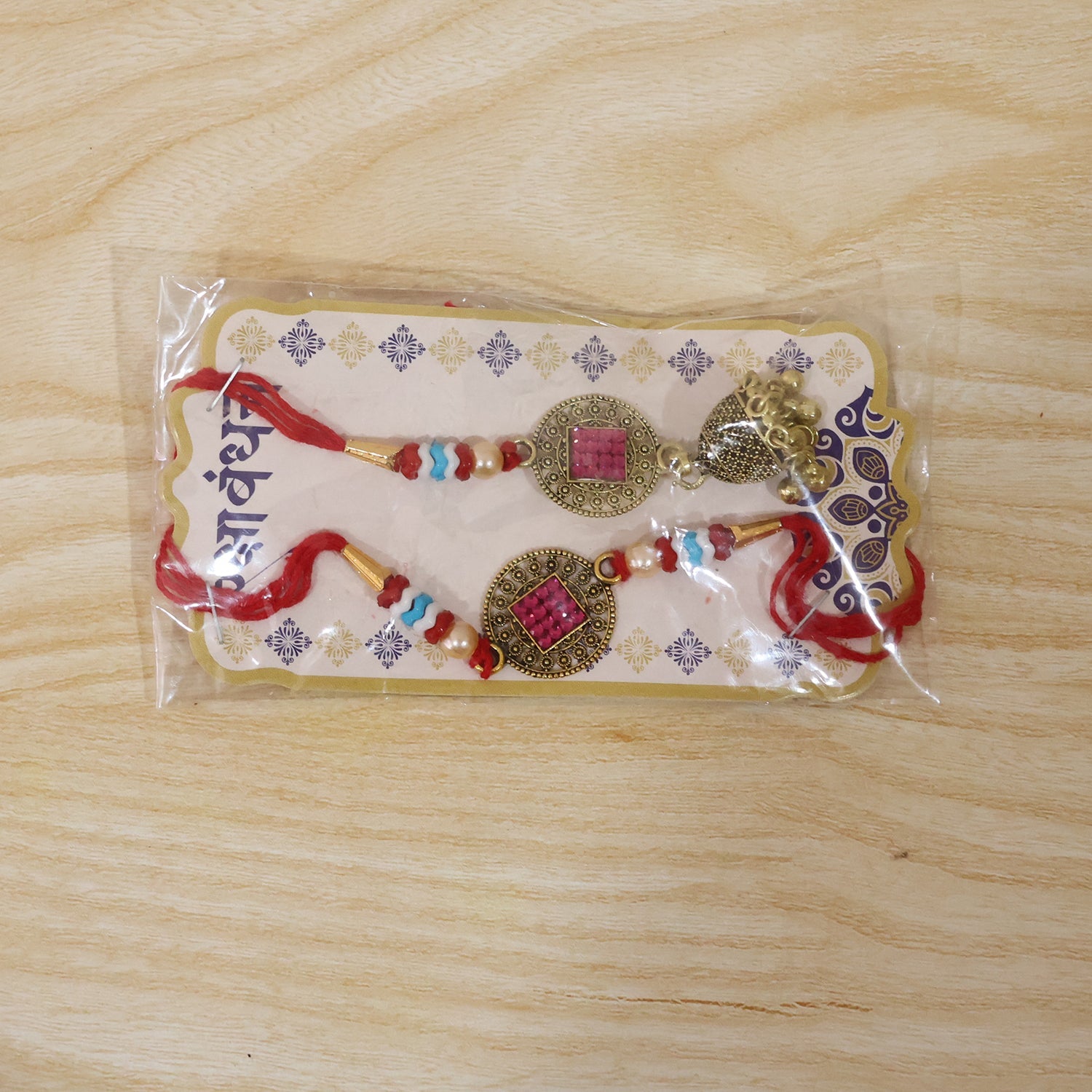 Detailed view of golden latkan on Meenakari Bead Bhabhi Rakhi