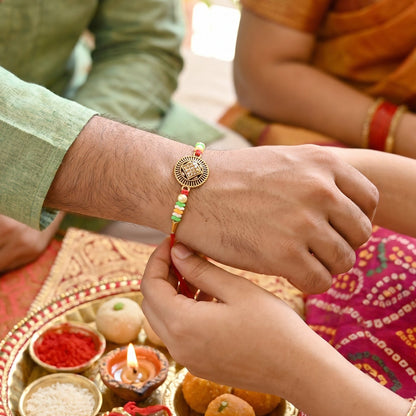 Side angle of Antique Coin Bhabhi Rakhi with coin centerpiece