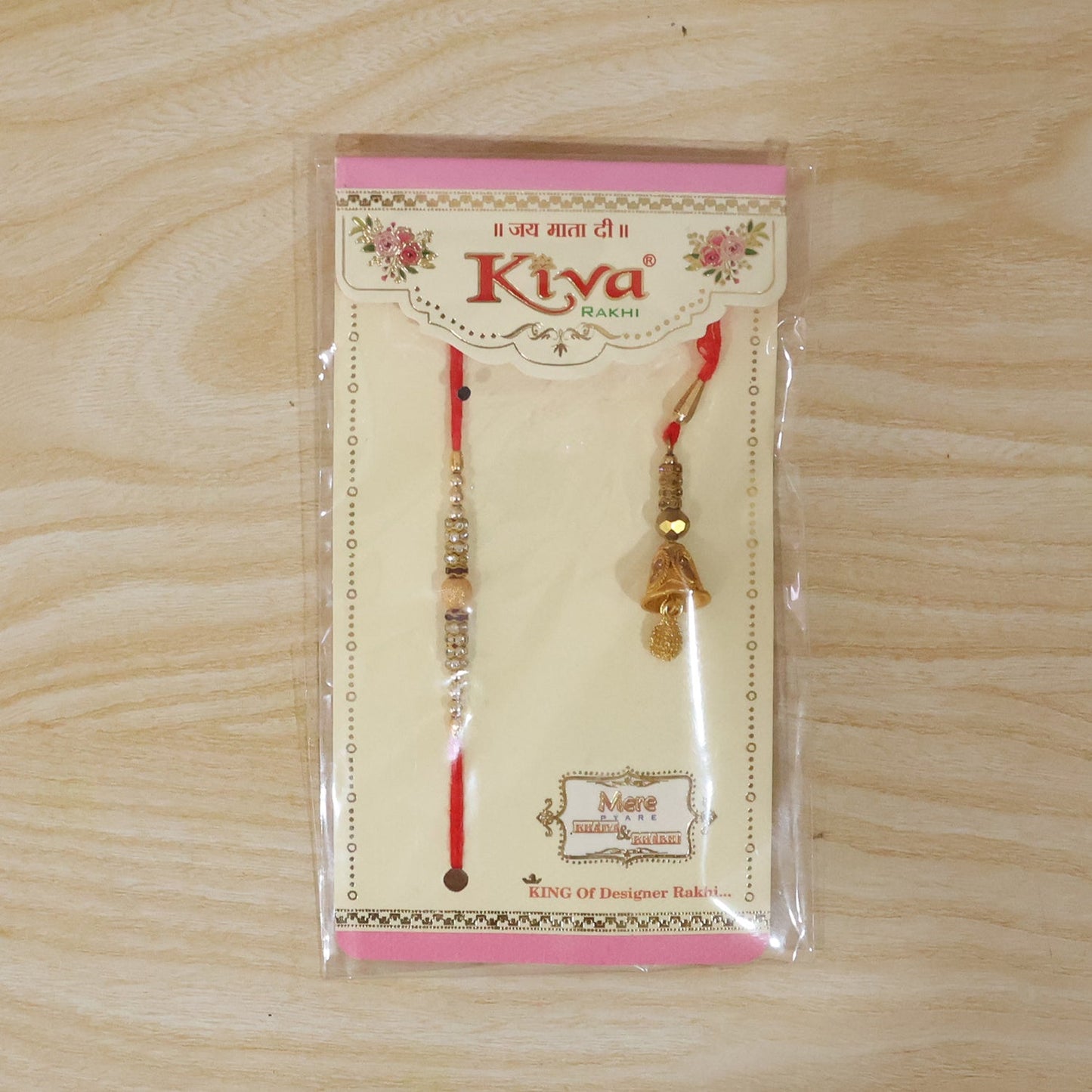 Side view of golden bhabhi rakhi with pearl drop latkan