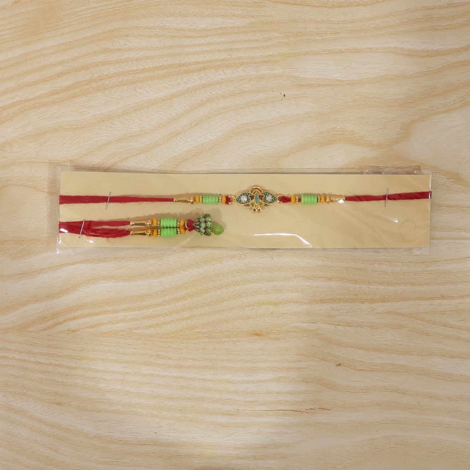 Om Peacock Bhabhi Rakhi displayed on white background