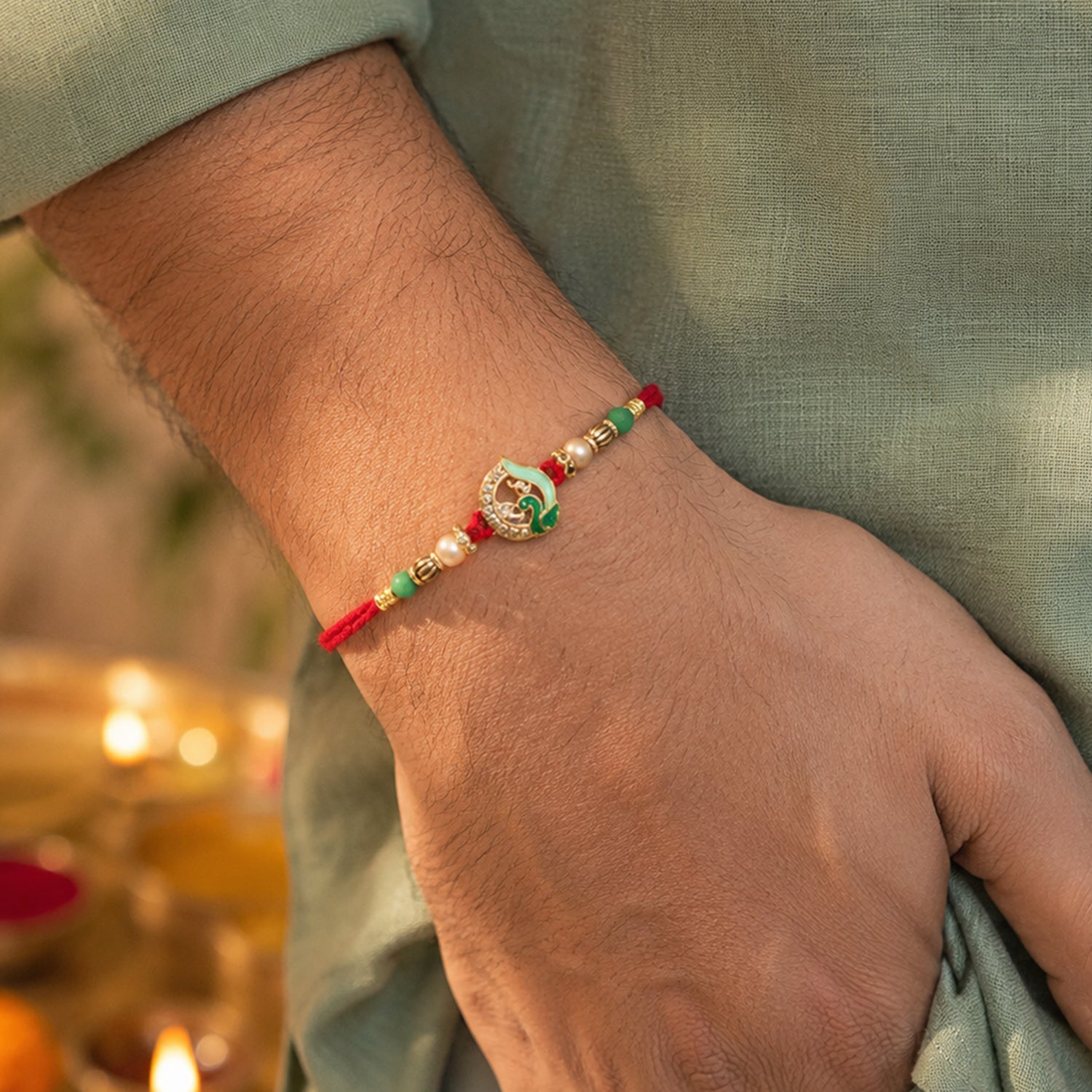 Close-up of pearl drop on Peacock Stone Bhabhi Rakhi
