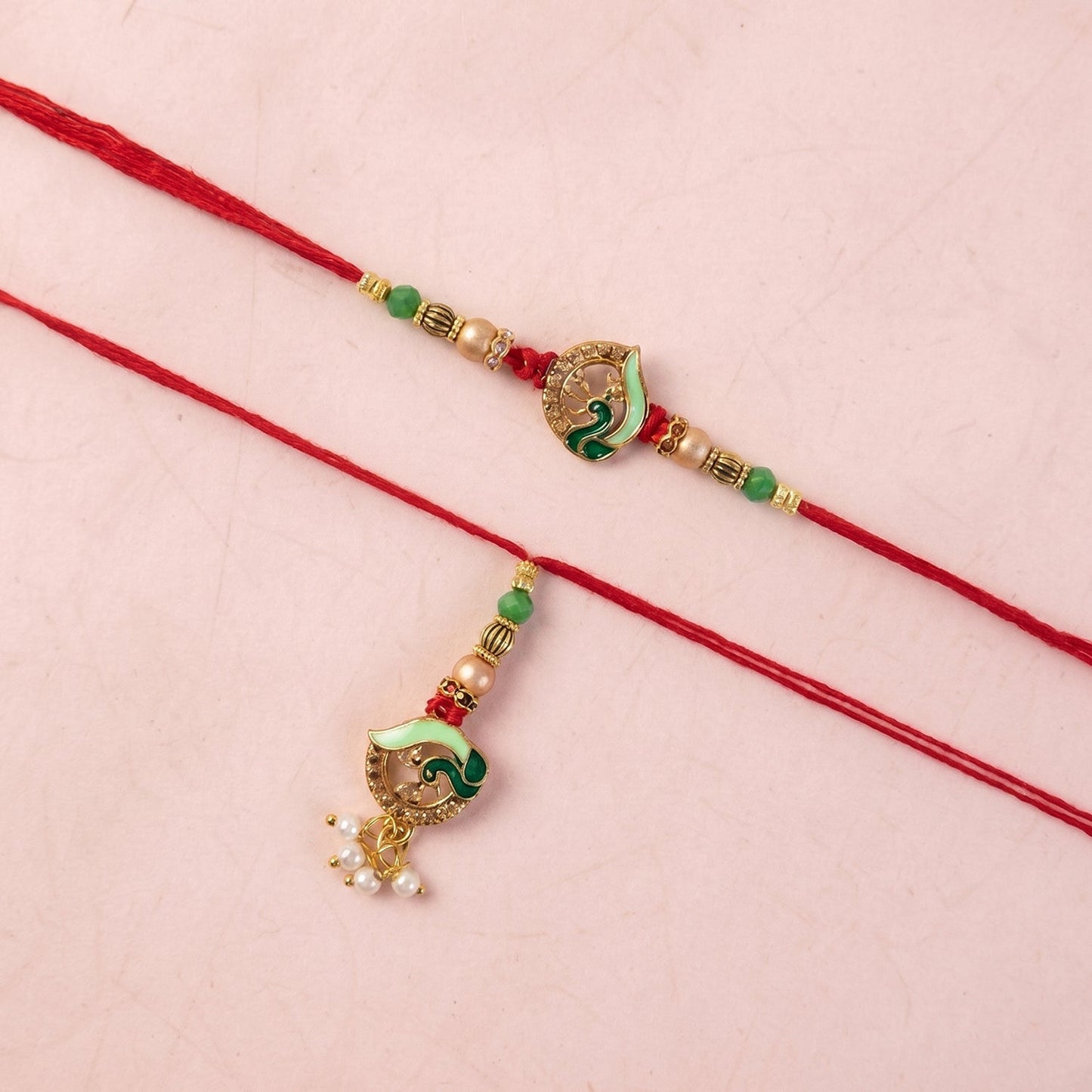 Pearl drop accent on Peacock Stone Bhabhi Rakhi