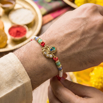 Side view of elegant Pearl Cluster Bhabhi Rakhi with charm