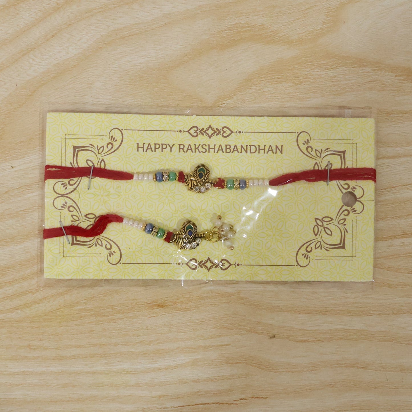 Pearl Cluster Bhabhi Rakhi with peacock charm fully displayed