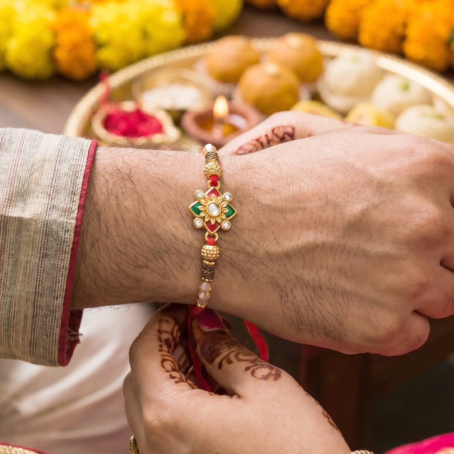 Close-up of Floral Pearl Bhabhi Rakhi intricate golden latkan