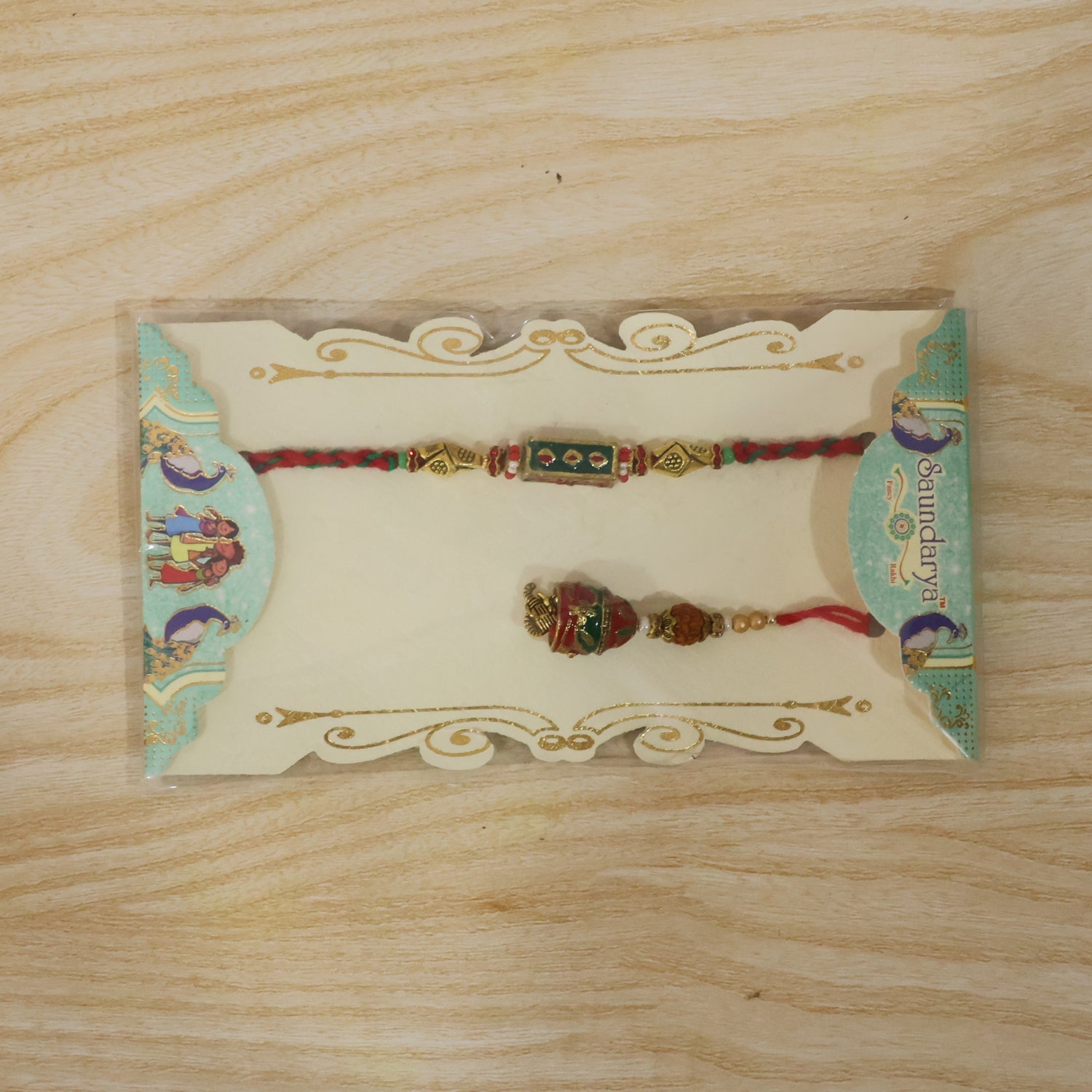 Front view of Meenakari Rectangle Bhabhi Rakhi with pearl drop