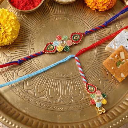 Side angle of multicolor thread Bhabhi Rakhi with floral latkan detail