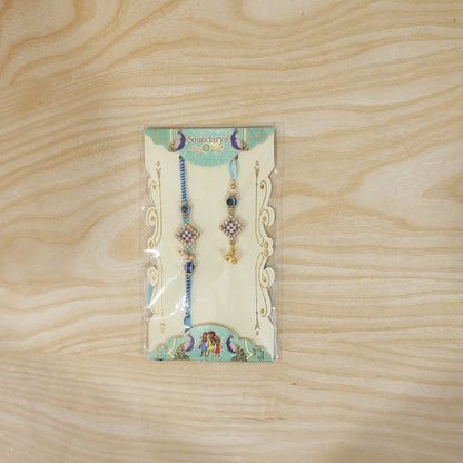 Pearl Bhabhi Rakhi twin charm with traditional thread wrapping