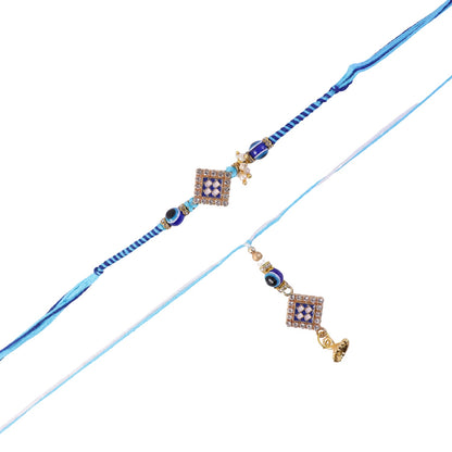 Pearl Bhabhi Rakhi twin charm laid out on surface