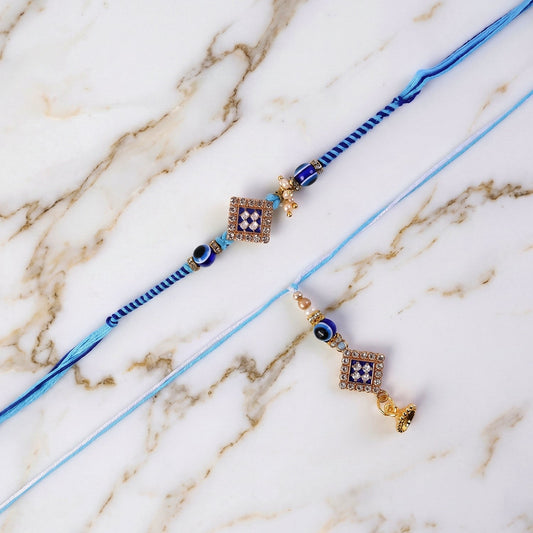 Packaged Pearl Bhabhi Rakhi with Twin Charm Design