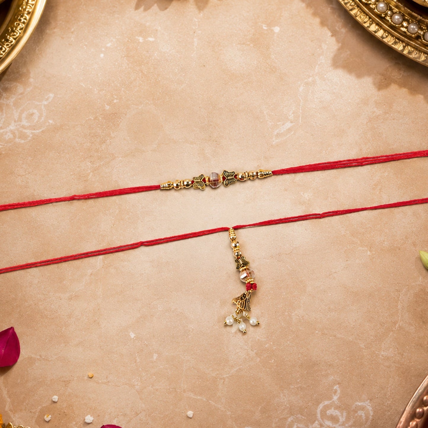 Golden latkan and stone detail of Bhabhi Rakhi