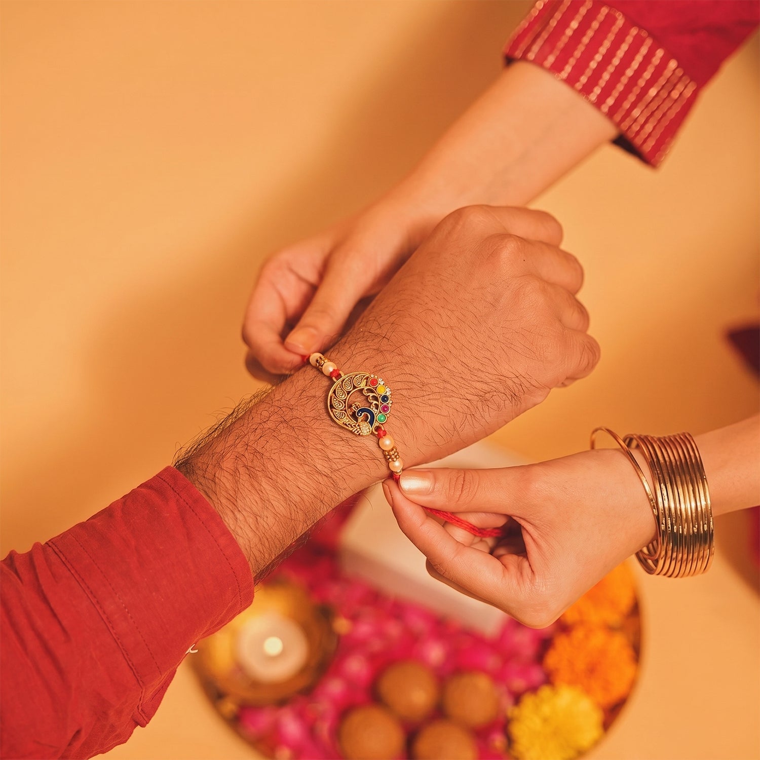 Peacock Motif Bhabhi Rakhi showcasing thread and pearls