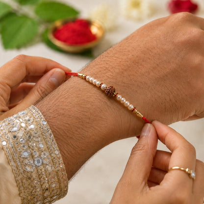 Handcrafted Brown Bead Bhabhi Rakhi with red tassel detail