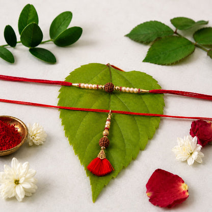 Brown Bead Bhabhi Rakhi with Red Tassel Latkan close-up