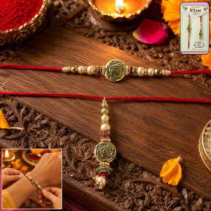 Antique Round Bhabhi Rakhi with pearl drop next to gift box