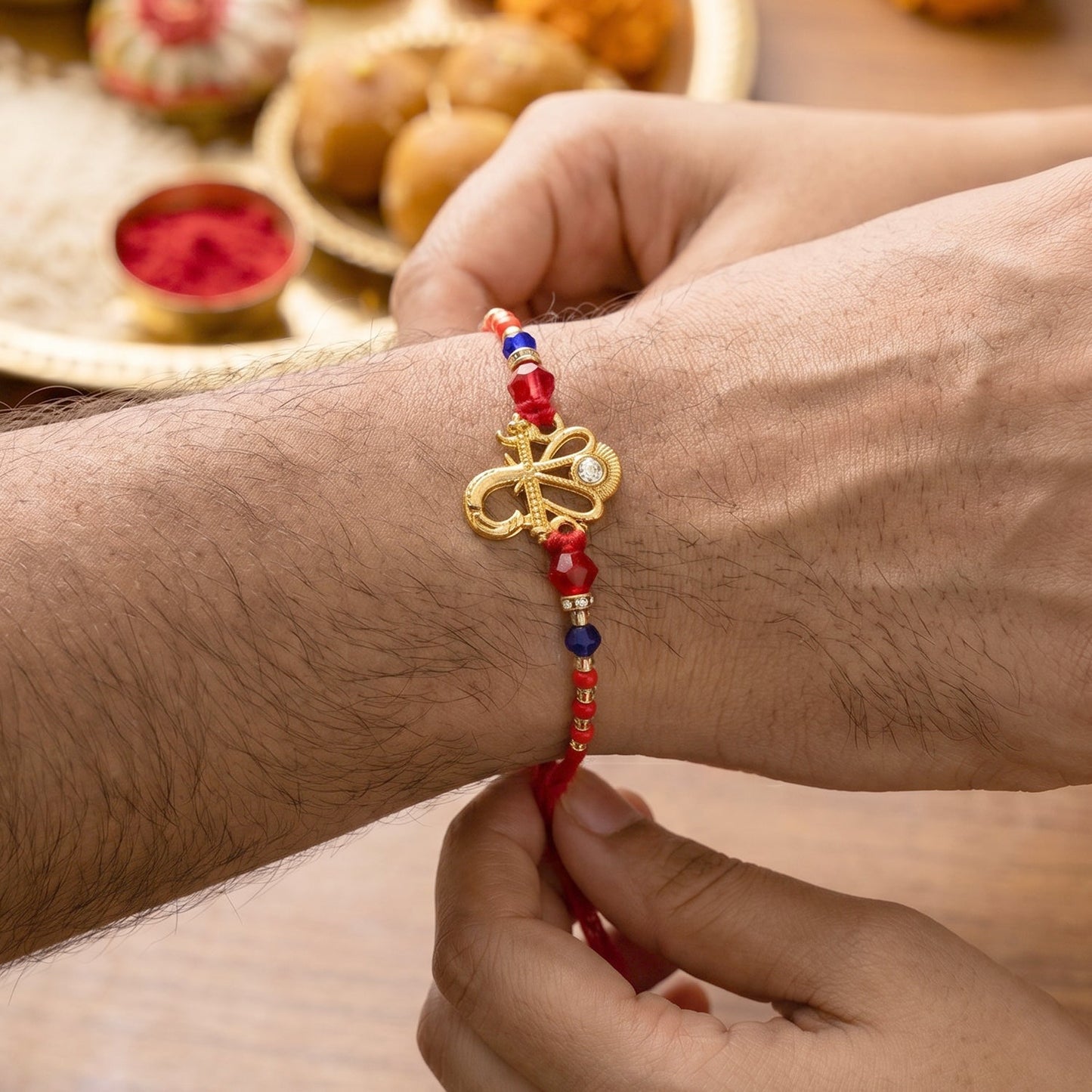 Om Charm Bhabhi Rakhi displayed with packaging