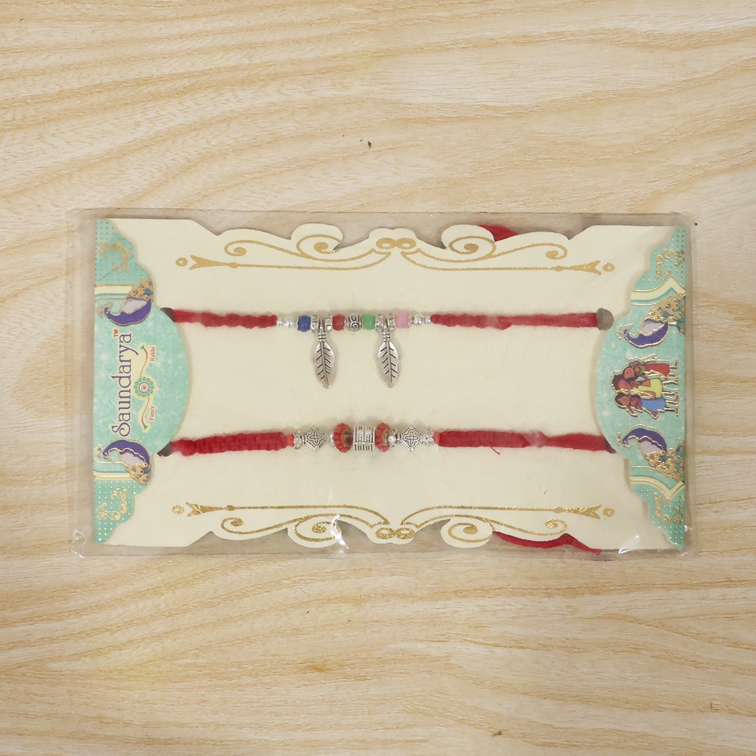 Decorative Leaf Charm Bhabhi Rakhi displayed on white background
