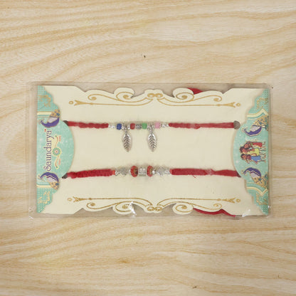 Decorative Leaf Charm Bhabhi Rakhi displayed on white background