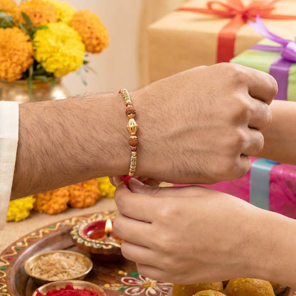 Pearl Bead Bhabhi Rakhi displayed on decorative surface